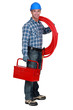 Plumber holding tool-box and plastic pipe
