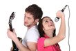 two people singing and playing guitar