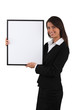 Businesswoman holding white board