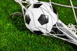 Foto: Soccer ball and goal net Soccer ball and goal net