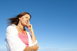 Worried depressed woman sky background