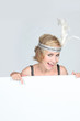 Woman in a flappers outfit with a board for your message