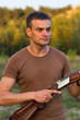 A young man with a gun