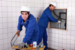 craftsman and apprentice working together