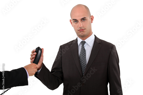 Photo: Businessman taking a phone call Businessman taking a phone call