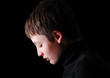 Profile of the upset teenage boy