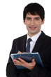 Male office worker with clip-board and pen