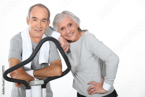 Photo: Senior couple using gym equipment Senior couple using gym equipment