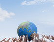 Crowd reaching for globe