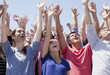 Cheering crowd with arms raised