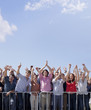 Cheering crowd with arms raised