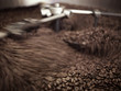 Coffee beans being processed in roasting machine