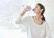 Woman drinking from water bottle