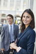Portrait of smiling businesswoman on urban street