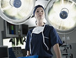 Portrait of confident nurse under surgical lights