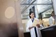 Doctor reviewing medical record in hospital elevator