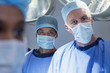 Portrait of confident surgeons in operating room