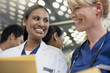 Smiling doctor and nurse in elevator