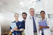 Portrait of smiling doctors and nurses in hospital