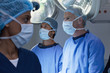Surgeons working in operating room
