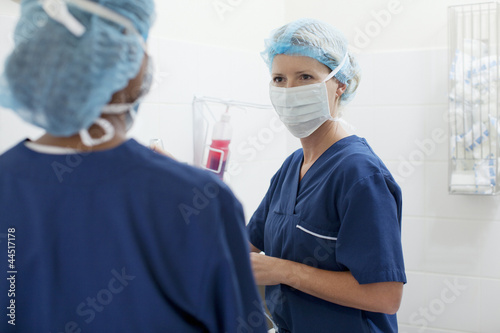 Photo: Doctors preparing for surgery in hospital Doctors preparing for surgery in hospital