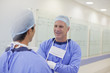Surgeons talking in hospital corridor