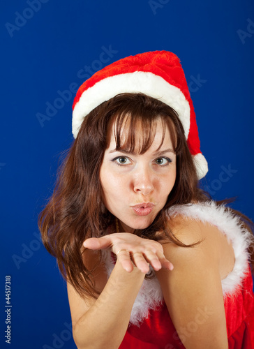 Photo: Air-kissing girl in christmas costume Air-kissing girl in christmas costume