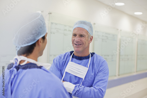 Photo: Surgeons talking in hospital corridor Surgeons talking in hospital corridor