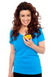 Fit girl drinking fresh orange juice directly from fruit