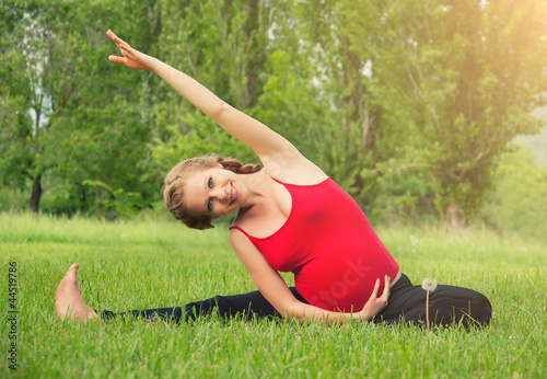 Photo: healthy pregnant woman doing yoga in nature healthy pregnant woman doing yoga in nature