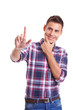 young casual man pushing a button