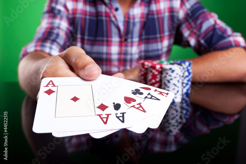 Photo: Cropped image of a winning four aces poker hand Cropped image of a winning four aces poker hand