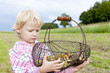 portrait of little girl with basket of mushrooms