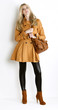 Photo: standing woman wearing coat and fashionable brown shoes with a h standing woman wearing coat and fashionable brown shoes with a h