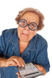 Elderly woman with calculator