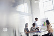 Photo: Businessman at chart leading meeting in conference room Businessman at chart leading meeting in conference room