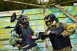 Photo: Paintball players in full gear at the shooting range Paintball players in full gear at the shooting range