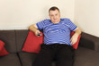 bored man with remote control