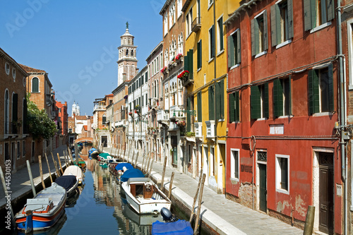 Photo: Canal and beautiful sunlit buildings in Venice. Canal and beautiful sunlit buildings in Venice.
