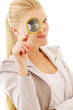 Young smiling businesswoman looking into a magnifying glass
