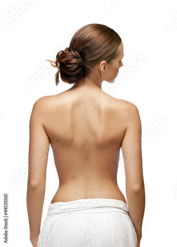Photo: A beautiful woman, back view, isolated on white background A beautiful woman, back view, isolated on white background