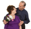 Elderly couple with flowers