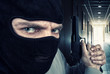Photo: Serious armed soldier with gun Serious armed soldier with gun