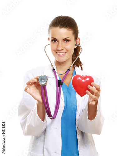 Foto: Female doctor with stethoscope holding heart Female doctor with stethoscope holding heart
