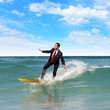 Young business person surfing on the waves