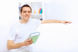 Young man at home with a book
