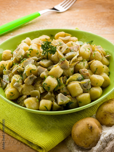 Photo: homemade gnocchi with artichoke,vegetarian food homemade gnocchi with artichoke,vegetarian food