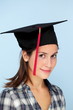Photo: Portrait of a beautiful smiling girl in graduation cap Portrait of a beautiful smiling girl in graduation cap