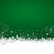 White snowflakes on green background