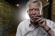 Senior man smoking a cigar